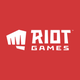 The official Riot Games logo, with a red background and white punching fist with "Riot Games in white text to the right of the fist.